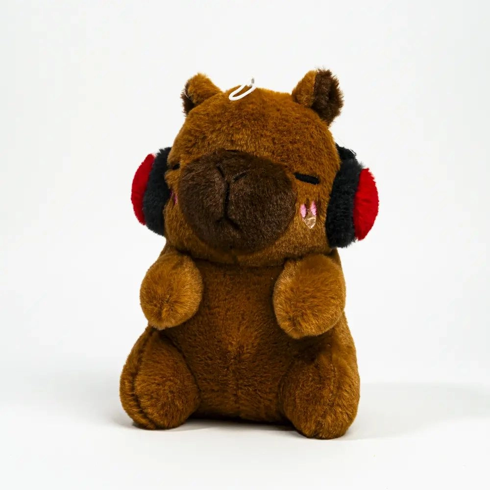Jucărie moale Capybara cu căști 23 cm
